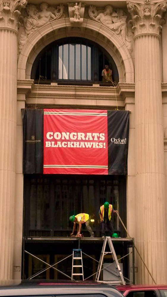 Outdoor banner that says congrats blackhawks