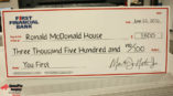 First Financial Bank giant check to Ronald McDonald House