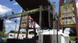 Stage pavilion and signs for a concert