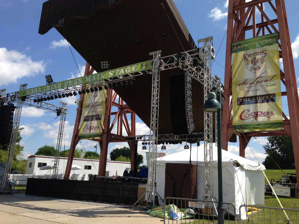 Stage pavilion and signs for a concert