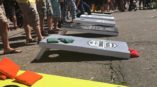 Group of people playing corn hole.