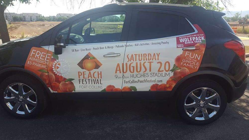 Peach festival advertisement on a car