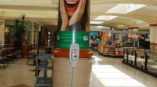 Retail advertisement on pillar in mall