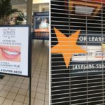 For lease sign and a cosmetic teeth whitening ad