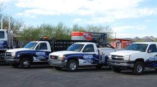 Fleet wrap including various sized trucks