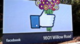 Facebook sign of thumbs up emoji holding flowers