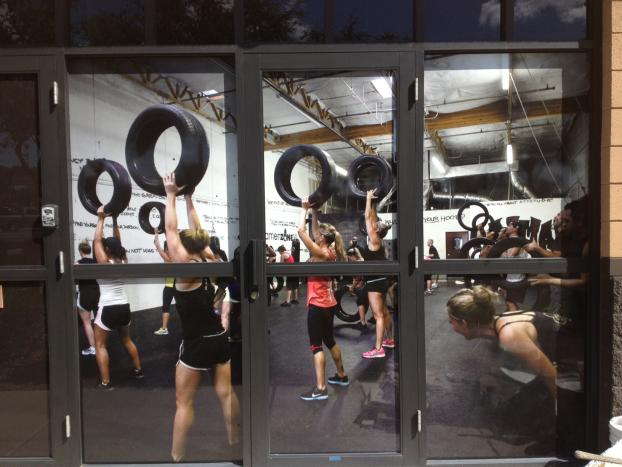 Door graphic of people working out at a gym