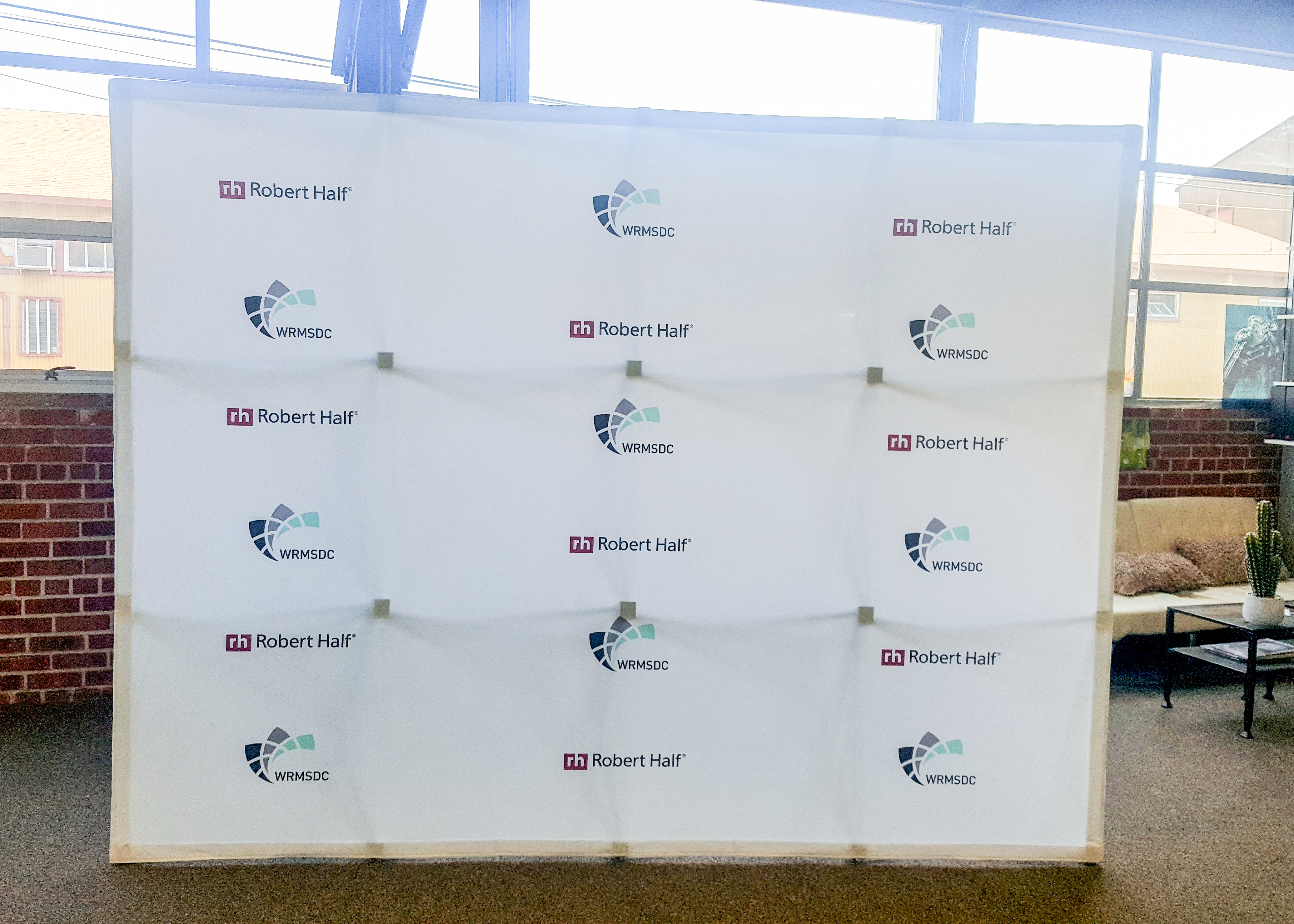 Large white step and repeat banner for Robert Half and WRMSDC.